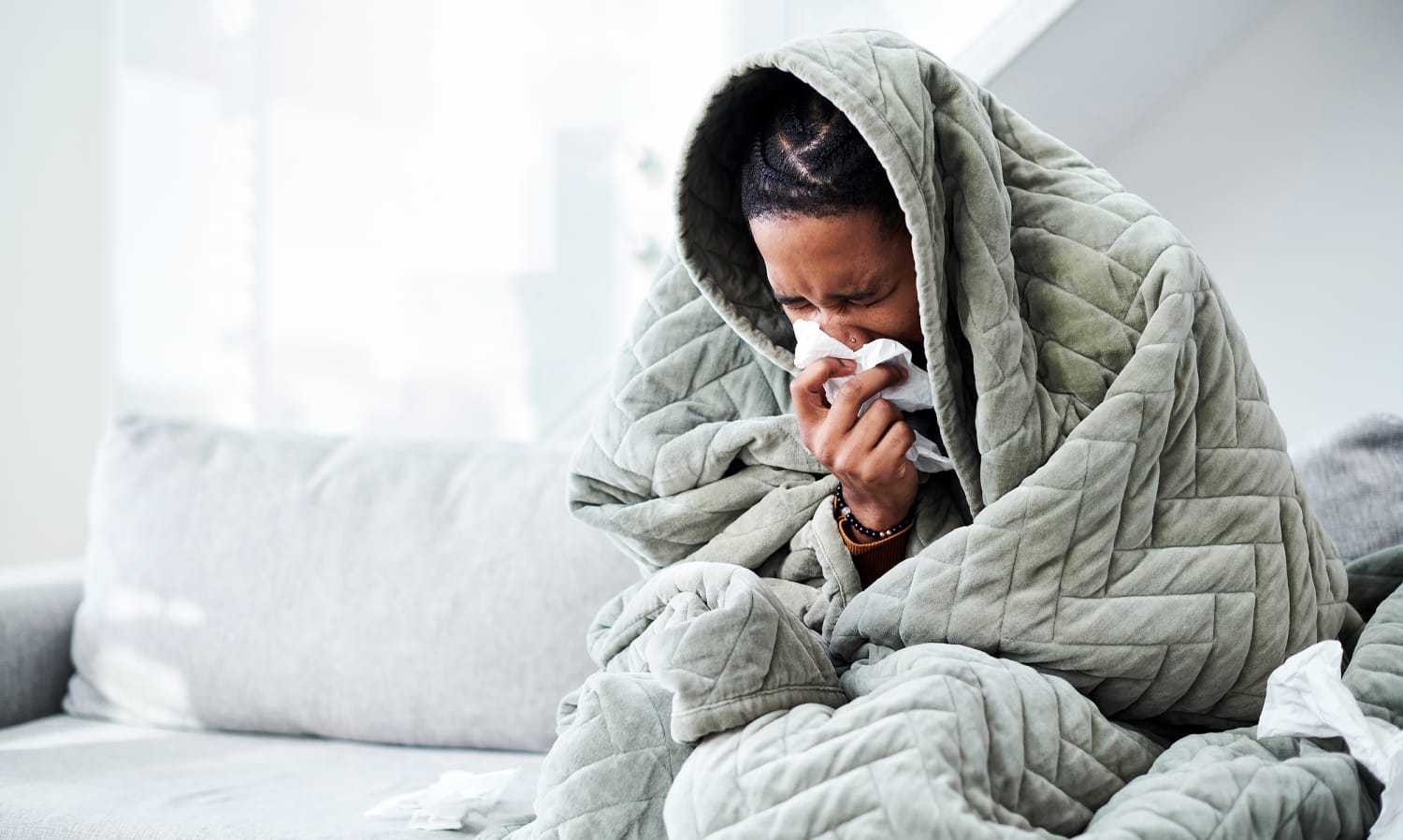 woman sneezing