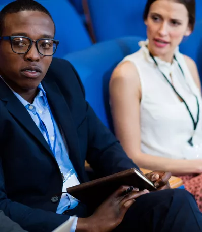 man and woman in a conference